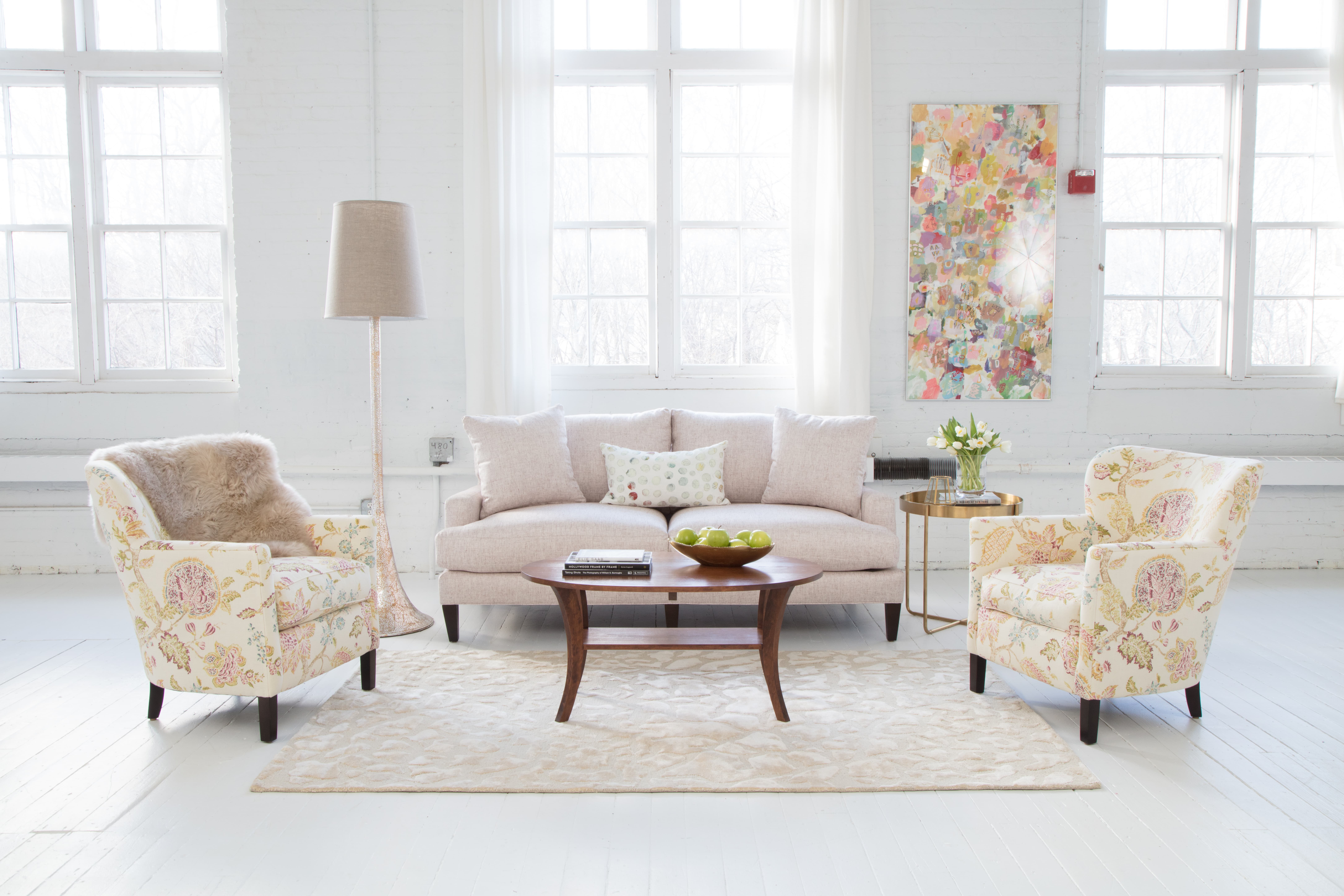 fully furnished living room with light pastel colors